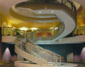 An open glass railing staircase that highlights the high quality of the materials.