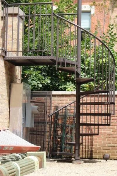 Installation example of Lamonaca Iron Works exterior spiral stairs and custom iron railings