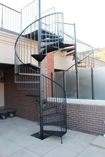 Installation example of Lamonaca Iron Works spiral stairs for commercial spaces (MTV)