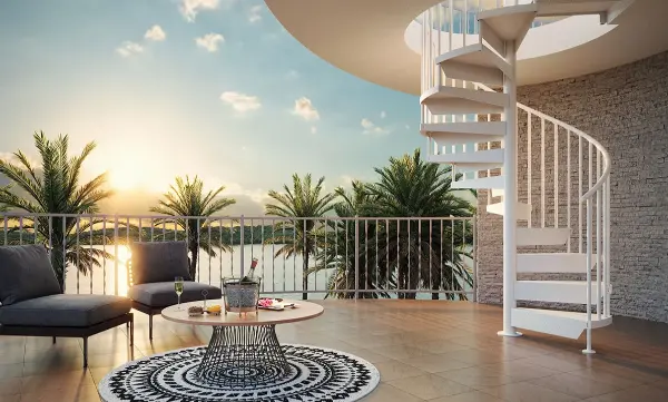 Outdoor aluminum spiral stairs leading to a rooftop deck