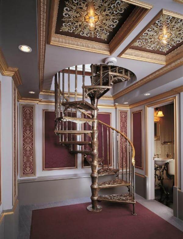 Indoor spiral staircase with antique-style decorative details